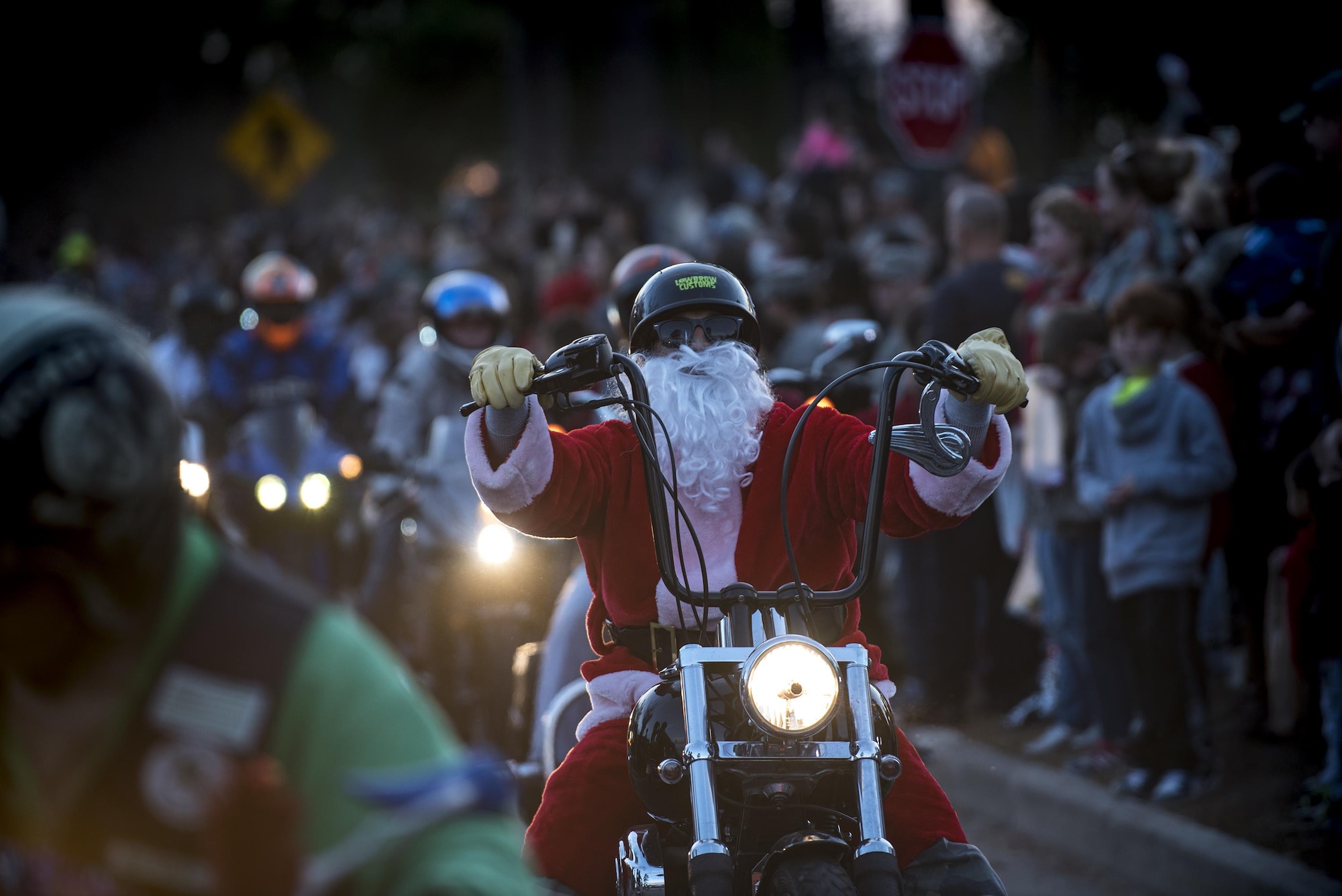Airman 1st Class Andrew Soares, 23d Medical Support Squadron medical lab technician, rides his motorcycle in a holiday parade, Dec. 2, 2016, at Moody Air Force Base, Ga. The ceremony included vendors, crafts, entertainment, door prizes, snow pits and visiting time with Santa and Mrs. Claus. (U.S. Air Force photo by Airman 1st Class Daniel Snider)