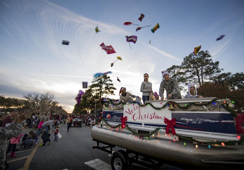 Col. Thomas Kunkel, 23d Wing commander, throws candy during a holiday parade, Dec. 2, 2016, at Moody Air Force Base, Ga. The parade was part of Moody’s Comprehensive Airmen Fitness Day that focused on the spiritual pillar. (U.S. Air Force photo by Airman 1st Class Daniel Snider)