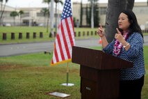Jessie Higa, a tour guide and volunteer Hickam historian, gives remarks during the dedication ceremony of Sgt. James Strickland's memorial marker Dec. 4, 2016, at Joint Base Pearl Harbor-Hickam, Hawaii. Strickland was killed near the memorial marker by Japanese gunfire during the attack on Pearl Harbor and Oahu Dec. 7, 1941. (U.S. Air Force photo by Staff Sgt. Alexander Martinez)