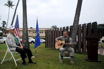 Durward Swanson (left) sings a song he wrote in memoriam of his friend, Sgt. James Strickland, during the dedication ceremony of Strickland's memorial marker Dec. 4, 2016, at Joint Base Pearl Harbor-Hickam, Hawaii. Strickland was killed near the memorial marker by Japanese gunfire during the attack on Pearl Harbor and Oahu Dec. 7, 1941. Swanson was with Strickland during his final moments, and has visited his grave at the National Memorial Cemetery of the Pacific for the past 10 years. (U.S. Air Force photo by Staff Sgt. Alexander Martinez)