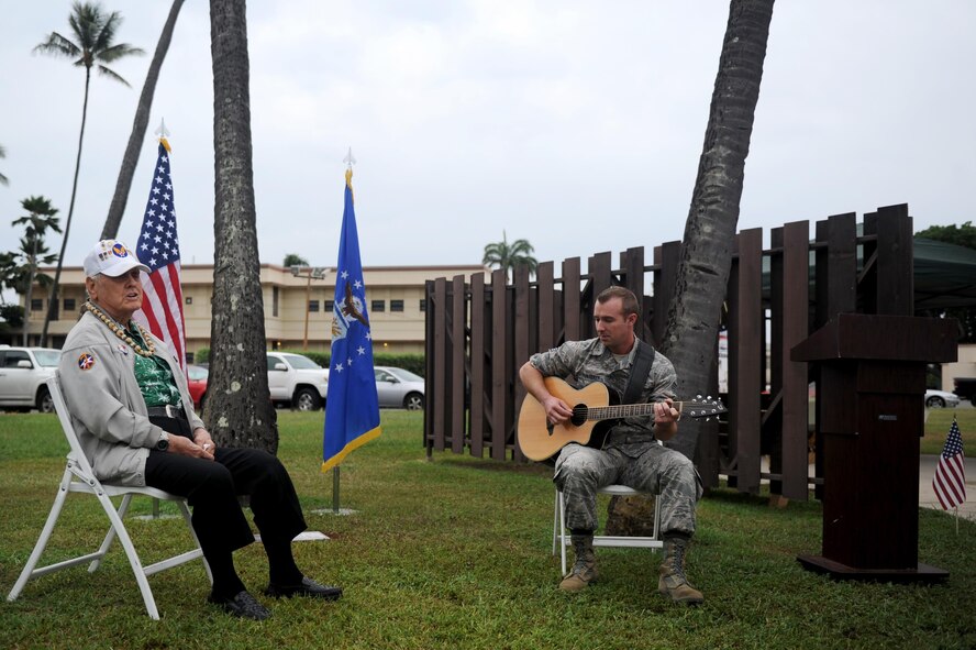 Durward Swanson (left) sings a song he wrote in memoriam of his friend, Sgt. James Strickland, during the dedication ceremony of Strickland's memorial marker Dec. 4, 2016, at Joint Base Pearl Harbor-Hickam, Hawaii. Strickland was killed near the memorial marker by Japanese gunfire during the attack on Pearl Harbor and Oahu Dec. 7, 1941. Swanson was with Strickland during his final moments, and has visited his grave at the National Memorial Cemetery of the Pacific for the past 10 years. (U.S. Air Force photo by Staff Sgt. Alexander Martinez)
