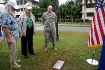 Durward Swanson and his escort (left), and Senior Master Sgt. Martin Sebok, an aircraft functional manager at Pacific Air Forces, view a memorial marker for Sgt. James Strickland during the marker's dedication ceremony Dec. 4, 2016, at Joint Base Pearl Harbor-Hickam, Hawaii. Strickland was killed near the memorial marker by Japanese gunfire during the attack on Pearl Harbor and Oahu Dec. 7, 1941. Swanson was with Strickland during his final moments, and has visited his grave at the National Memorial Cemetery of the Pacific for the past 10 years. (U.S. Air Force photo by Staff Sgt. Alexander Martinez)