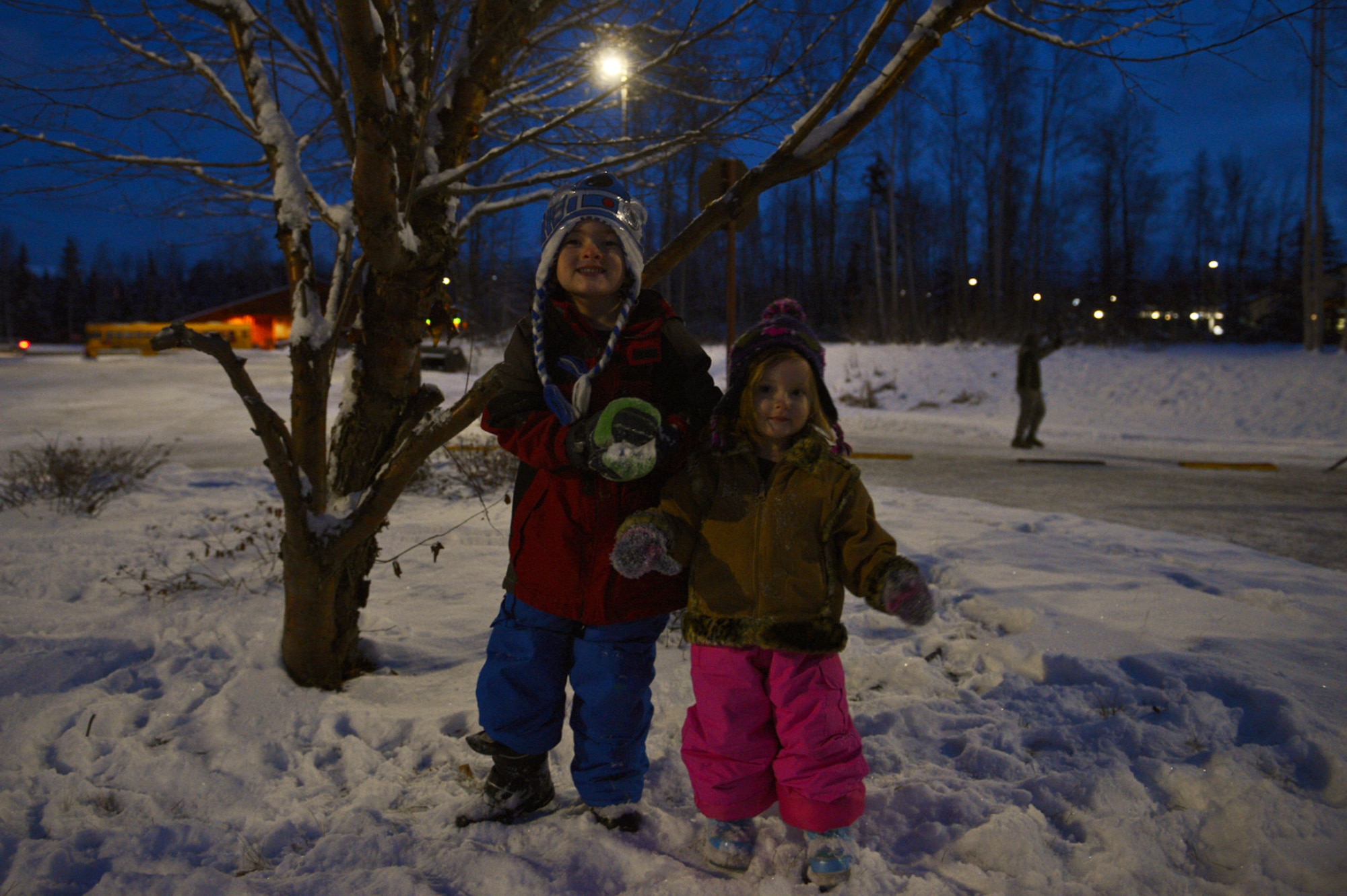 Children play in the snow during the annual Joint Base Elmendorf-Richardson Holiday Tree Lighting, at JBER, Alaska, Dec. 1, 2016. The annual event brings service members, families, and wing leadership together to begin the holiday season. 