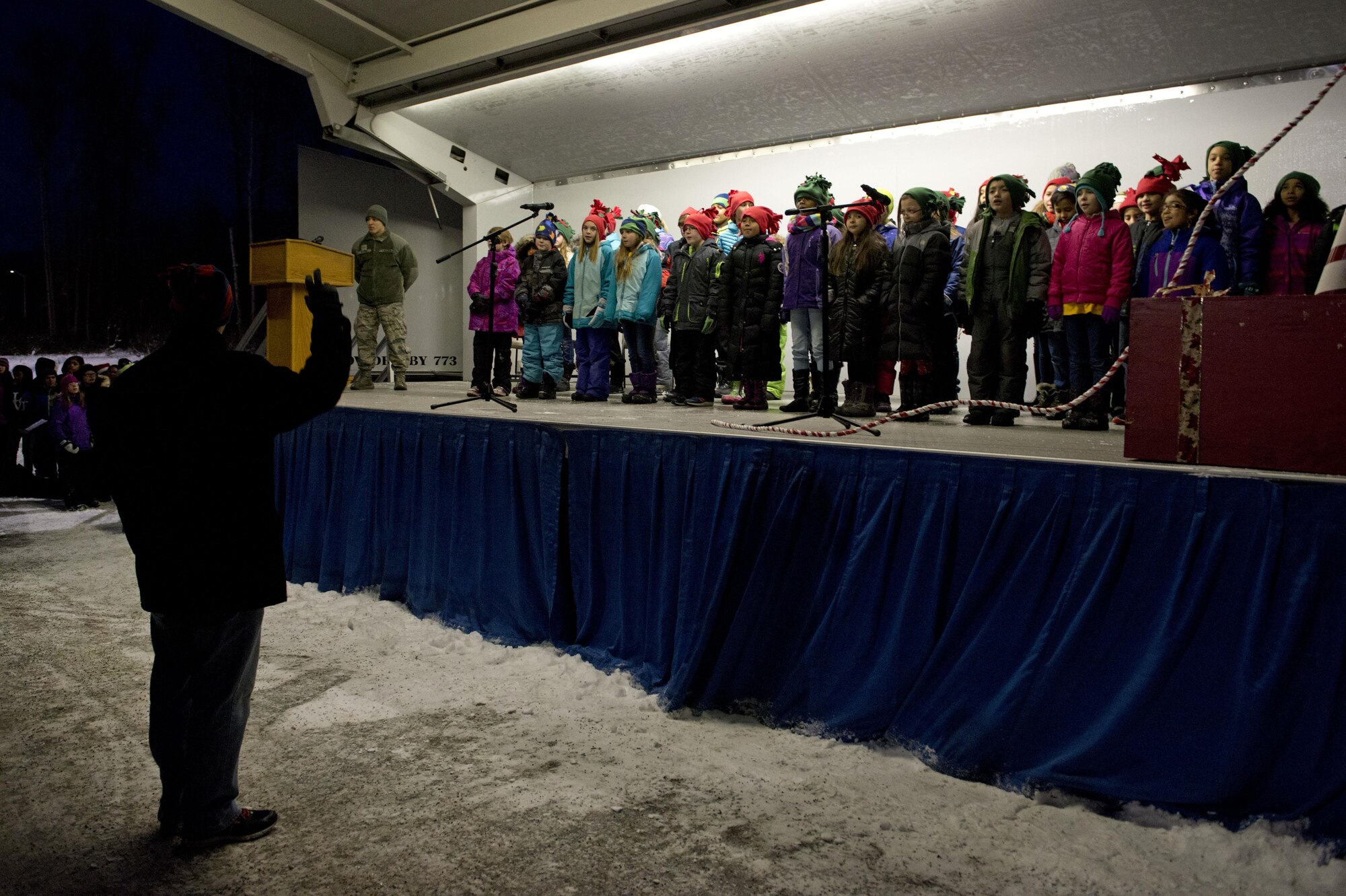 The Ursa Major Elementary School choir sings Christmas songs during the annual Joint Base Elmendorf-Richardson Holiday Tree Lighting in front of the Joint Military Mall, adjacent to the Commissary, Dec. 1, 2016. 