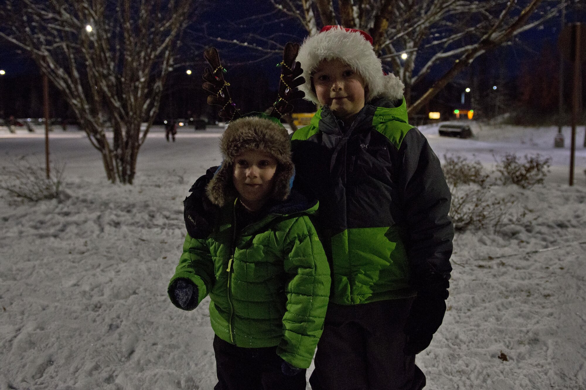 Children play in the snow during the annual Joint Base Elmendorf-Richardson Holiday Tree Lighting, at JBER, Alaska, Dec. 1, 2016. The annual event brings service members, families, and wing leadership together to begin the holiday season. 