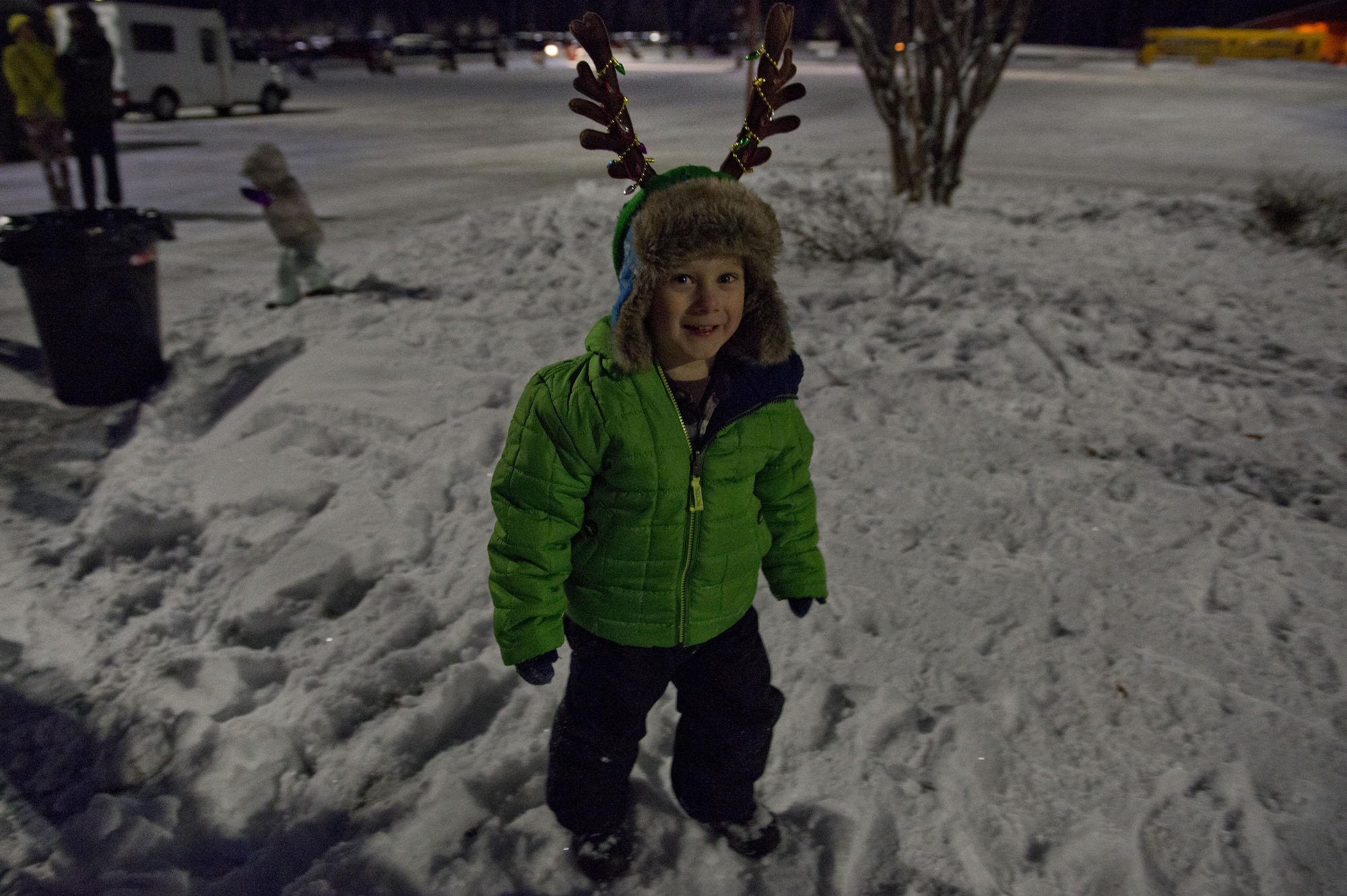 Children play in the snow during the annual Joint Base Elmendorf-Richardson Holiday Tree Lighting, at JBER, Alaska, Dec. 1, 2016. The annual event brings service members, families, and wing leadership together to begin the holiday season. 