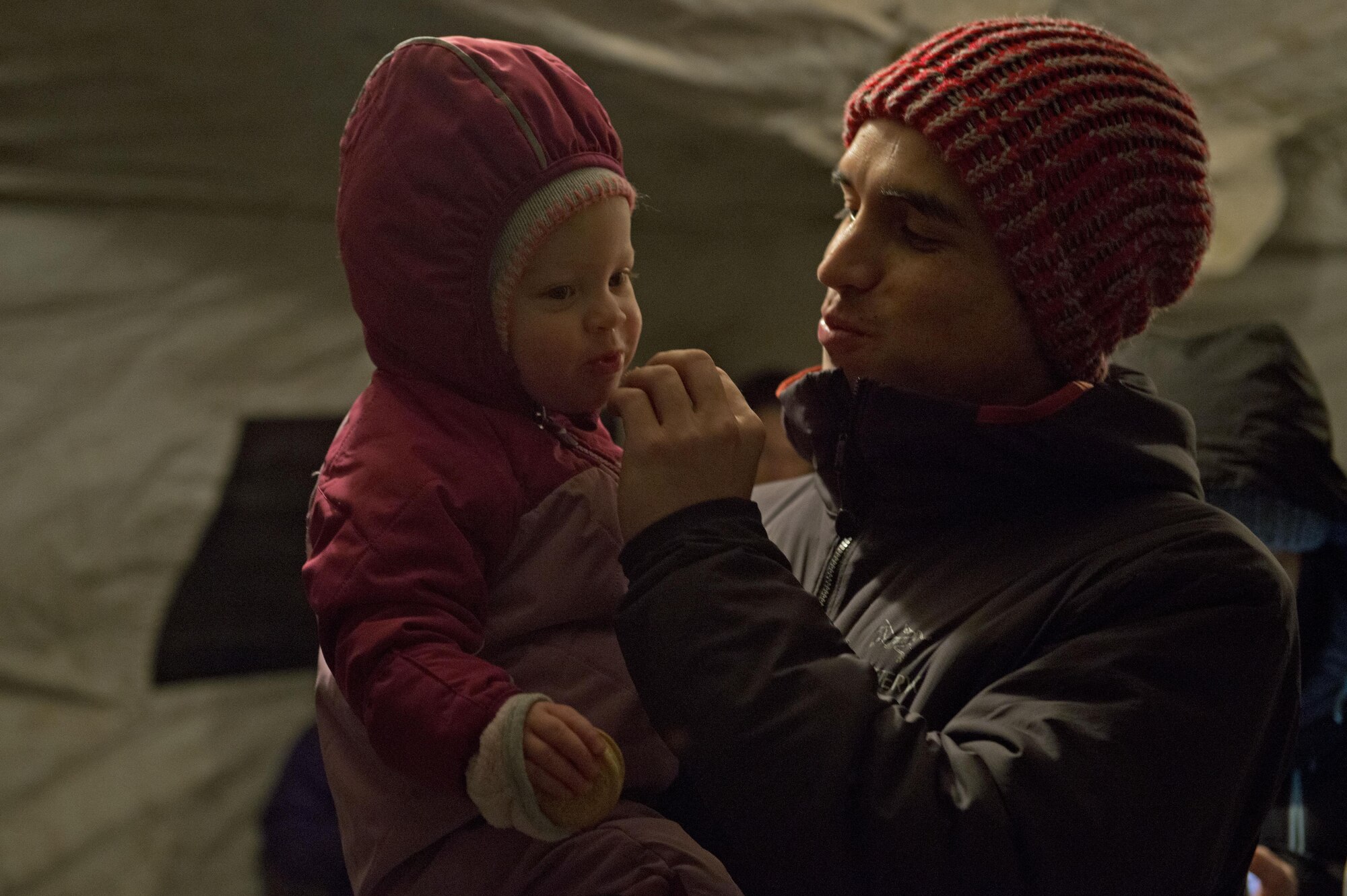 Service members and families enjoy cookies and hot chocolate during the annual Joint Base Elmendorf-Richardson Holiday Tree Lighting, at JBER, Alaska, Dec. 1, 2016. The event featured musical selections from the Ursa Major Elementary School choir and Central Middle School choir, and a guest appearance by Mr. and Mrs. Santa Claus. 