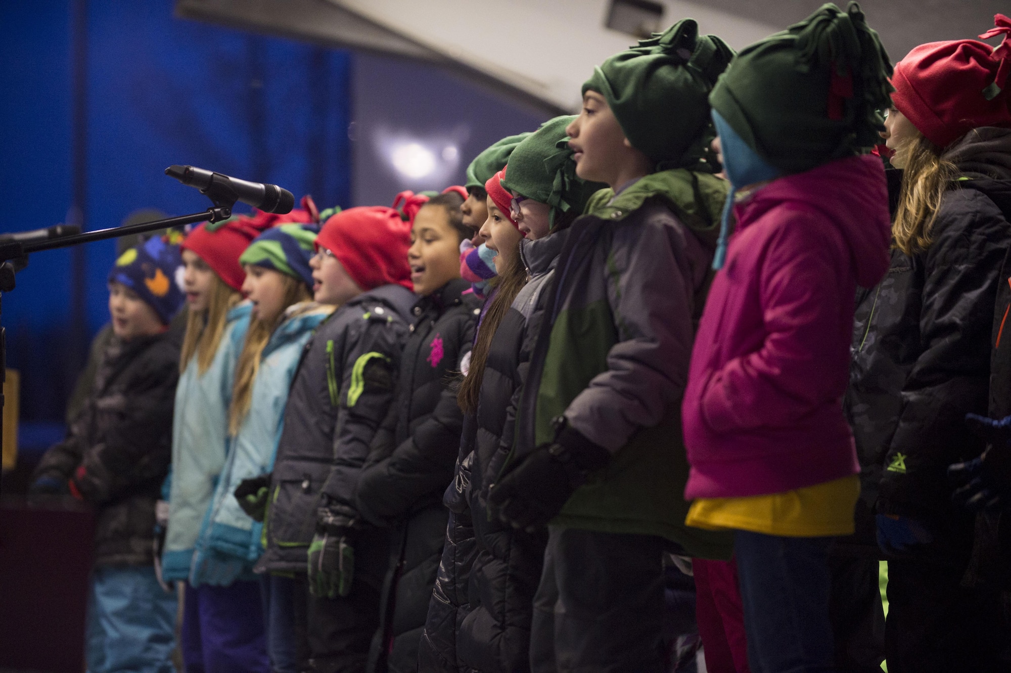 The Ursa Major Elementary School choir sings Christmas songs during the annual Joint Base Elmendorf-Richardson Holiday Tree Lighting in front of the Joint Military Mall, adjacent to the Commissary, Dec. 1, 2016. 