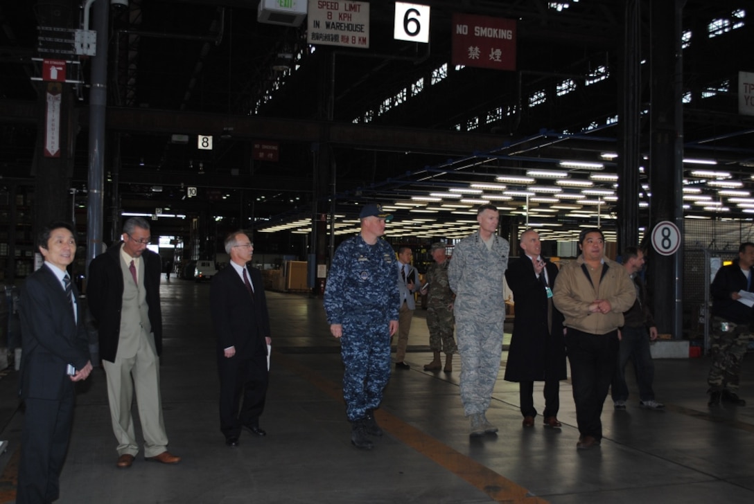 DLA Director Air Force Lt. Gen. Andy Busch joins DLA Distribution leaders on a tour of the Yokosuka facility in 2016. 