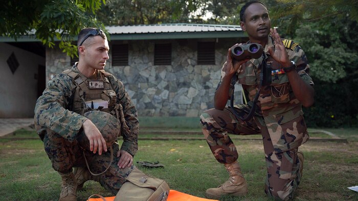 1st Lt. Brandon Hummer, left, teaches a class on optics to Sri Lankan Marines with the assistance of an English translator and Sri Lankan Marine during a Theater Security Cooperation engagement at Sri Lanka Naval Base, Trincomalee, Nov. 23, 2016. Both the United States and Sri Lanka have a continuing interest in strengthening their partnership based on common interests related to maritime security, humanitarian assistance and disaster relief preparedness, and the security and stability in the region. The 11th MEU, part of the Makin Island Amphibious Ready Group, is operating in the U.S. 7th Fleet’s area of responsibility in support of enhancing ties with partner and allied nations in the Indo-Asia-Pacific region. 
