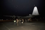 U.S. Marines with Marine Attack Squadron 542 (VMA) 542, exit a U.S. Air Force C-130J upon their arrival at Chitose Air Base, Dec. 2, 2016.   VMA-542 journeyed to Chitose to partake in the Aviation Relocation Training program in an effort to increase operational readiness between the U.S. Marine Corps and the Japan Air Self Defense Force, improve interoperability and reduce noise concerns of aviation training on local communities by disseminating training locations throughout Japan. 