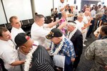 World War II veterans arriving at Honolulu International Airport is greeted by service members and Sailors assigned to various commands throughout Joint Base Pearl Harbor-Hickam. Dec. 3, 2016. More than 100 World War II veterans, including Pearl Harbor survivors, arrived in Honolulu to participate in the remembrance events throughout the week to honor the courage and sacrifices of those who served during Dec. 7, 1941, and throughout the Pacific Theater. Dec. 7, 2016, marks the 75th anniversary of the attacks on Pearl Harbor and Oahu. As a Pacific nation, the U.S. is committed to continue its responsibility of protecting the Pacific sea-lanes, advancing international ideals and relationships, well as delivering security, influence, and responsiveness in the region. 