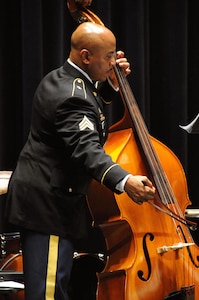 Sgt. Hasim Sharrieff, a musician from Queens, New York assigned to the U.S. Army Reserve’s 78th Army Band, plays the bass cello during the 78th’s holiday concert Dec. 3 in Pemberton, New Jersey.  The 78th frequently holds community performances such as concerts.