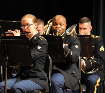 Spc. Natalie Harper (left), a flutists from Reading, Pennsylvania assigned to the U.S. Army Reserve’s 78th Army Band, performs with her band mates during the 78th’s holiday concert Dec. 3 in Pemberton, New Jersey.  More information about the 78th can be found on their Facebook page.