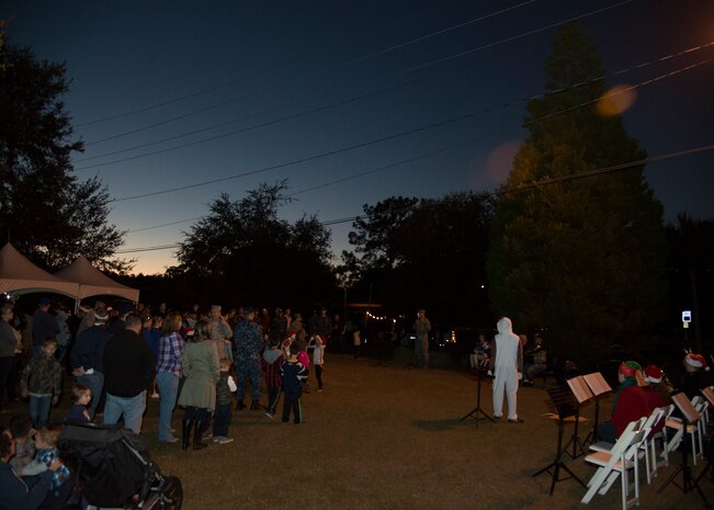 Service members and their families gather at Joint Base Charleston - Weapons Station for the annual holiday tree lighting ceremony Dec. 1, 2016. Families and children gathered for caroling, hot chocolate, photos with Santa and the annual lighting of the holiday tree on base. 