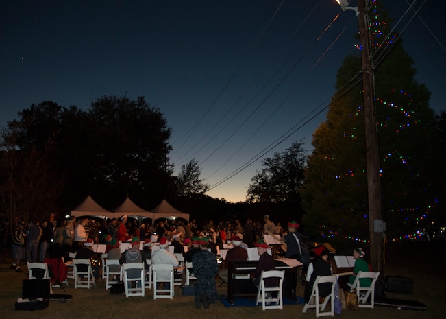 Service members and their families gather at Joint Base Charleston - Weapons Station for the annual holiday tree lighting ceremony Dec. 1, 2016. Families and children gathered for caroling, hot chocolate, photos with Santa and the annual lighting of the holiday tree on base. 