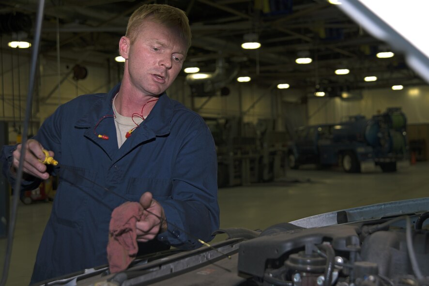 U.S. Air Force Staff Sgt. Joshua Patterson, 20th Logistics Readiness Squadron vehicle maintenance journeyman, checks the oil level of a government-owned vehicle during an inspection at Shaw Air Force Base, S.C., Dec. 1, 2016. Checking the fluid levels of a vehicle is one of the tasks vehicle maintenance Airmen must complete as part of an inspection checklist confirming the serviceability of government vehicles. (U.S. Air Force photo by Airman 1st Class Kathryn R.C. Reaves)