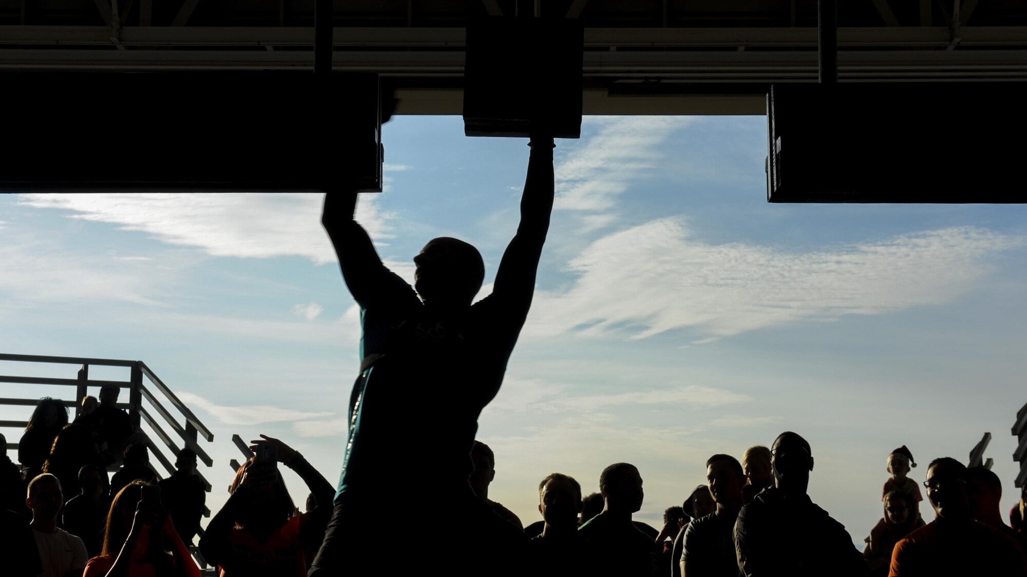 Brent Steffensen, a leader of the Alpha Warrior competition, demonstrates how to complete the obstacle course during the Alpha Warrior competition at Hurlburt Field, Fla., Dec. 3, 2016. The course was composed of several obstacles including a salmon ladder, three ring ropes and a rope climb. Contestants had to finish the course in under three minutes. (U.S. Air Force photo by Airman Dennis Spain)