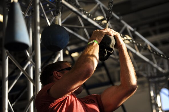 Tech. Sgt. Scott Underdahl, an explosive ordnance disposal instructor with the 366th Training Squadron Detachment 3, swings through an obstacle during the Alpha Warrior competition at Hurlburt Field, Fla., Dec. 3, 2016. Underdahl competed in the Alpha Warrior competition which is a timed obstacle course designed to push participants to their mental and physical limits. (U.S. Air Force photo by Airman Dennis Spain)