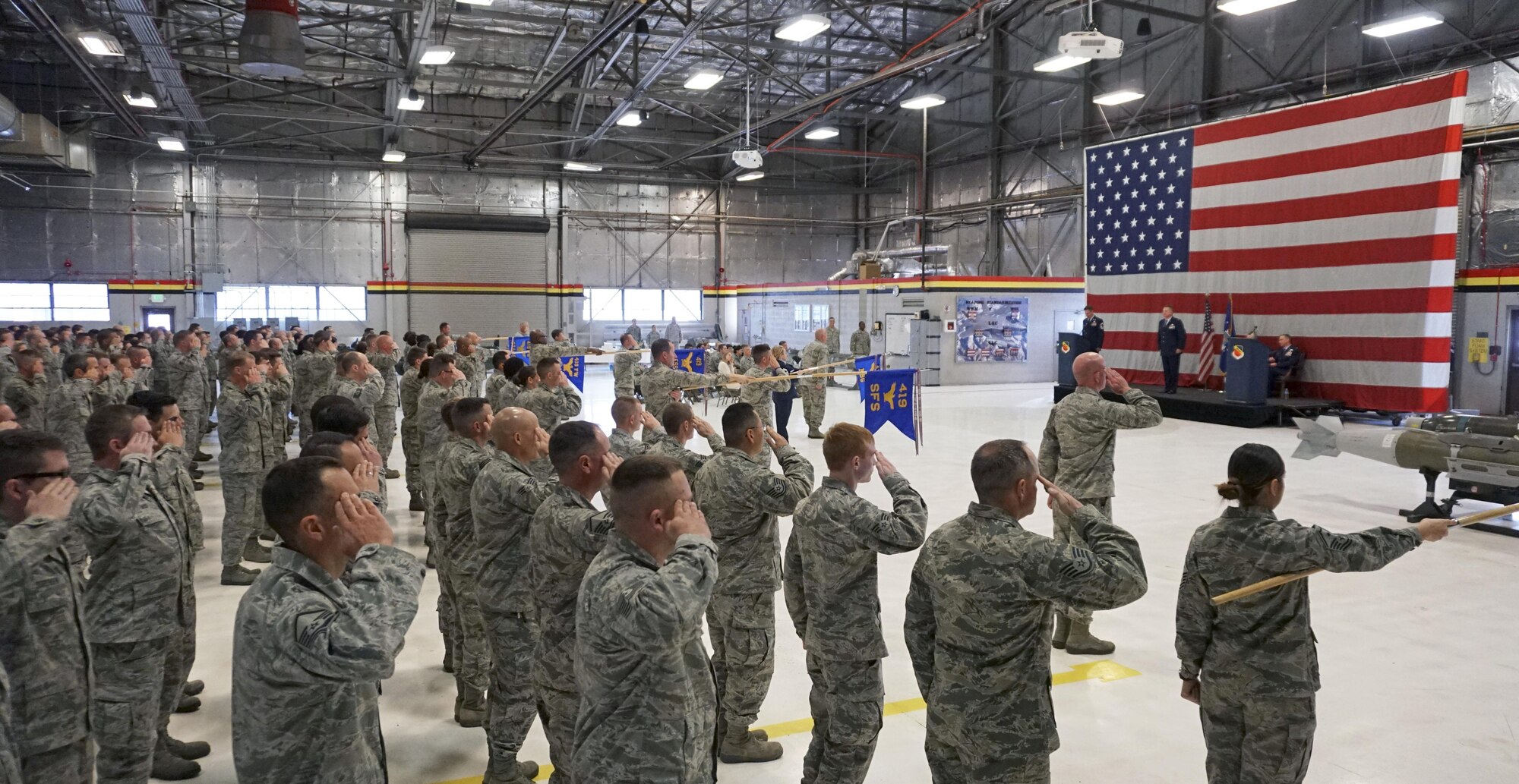 Air Force reservists in the 419th Mission Support Group render a first salute to new commander Col. Kent Hansen, who assumed command of the group during a ceremony at Hill Air Force Base, Utah, Dec. 4. (U.S. Air Force photo/Tech. Sgt. Michael McCool)