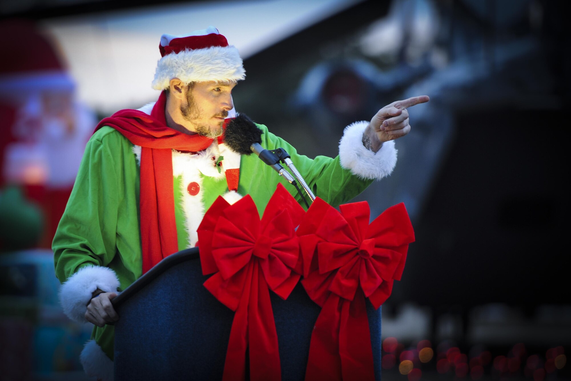 Robert Scott, the community center director with the 1st Special Operations Force Support Squadron, speaks during the Christmas tree lighting ceremony at Hurlburt Field, Fla., Dec. 2, 2016. Hurlburt Field invited Air Commandos and families to celebrate the holiday season with a ceremony including lighting a Christmas tree, pinning yellow ribbons on a wreath and a visit from Santa Claus. (U.S. Air Force photo by Airman Dennis Spain)