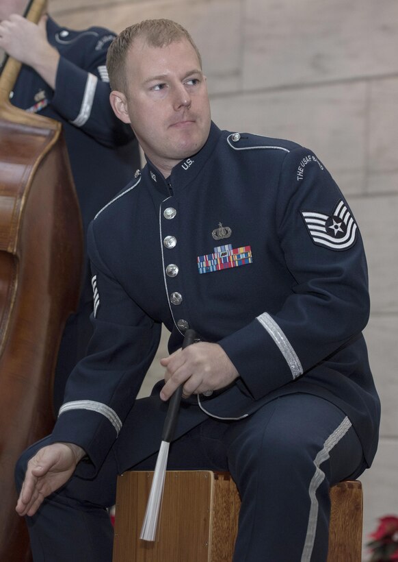 Tech. Sgt. David McDonald, U.S. Air Force Band’s Airmen of Note drummer, plays a percussion instrument at the National Museum of American History in Washington, D.C., Dec. 3, 2016. The group played a total of six 30-minute sets spanning the weekend and highlighted compositions by James Taylor and other artists. (U.S. Air Force photo by Senior Airman Jordyn Fetter)