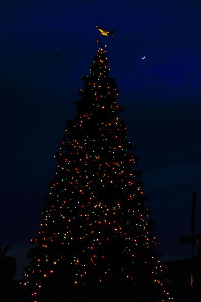 Team Hurlburt held a Christmas tree lighting ceremony at Hurlburt Field, Fla., Dec. 2, 2016. 
Air Commandos and their families celebrated by pinning yellow ribbons on a wreath to remember family members who are currently deployed and receiving a visit from Santa Claus. (U.S. Air Force photo by Airman Dennis Spain)
