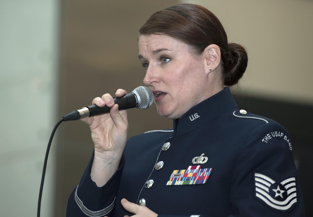 Tech. Sgt. Paige Wroble, U.S Air Force Band’s Airmen of Note vocalist, sings at the National Museum of American History in Washington, D.C., Dec. 3, 2016. The group played holiday favorites throughout the afternoon for museum visitors to spread cheer during the season. (U.S. Air Force photo by Senior Airman Jordyn Fetter)