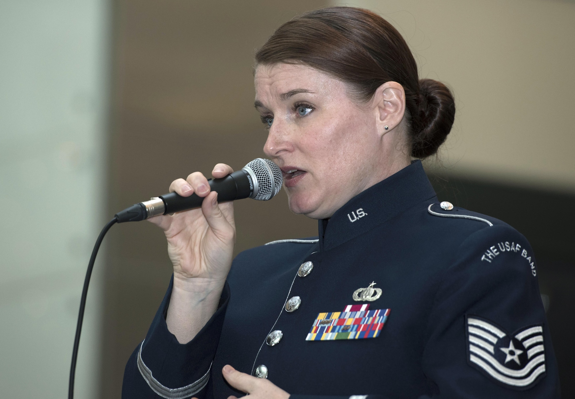 Tech. Sgt. Paige Wroble, U.S Air Force Band’s Airmen of Note vocalist, sings at the National Museum of American History in Washington, D.C., Dec. 3, 2016. The group played holiday favorites throughout the afternoon for museum visitors to spread cheer during the season. (U.S. Air Force photo by Senior Airman Jordyn Fetter)