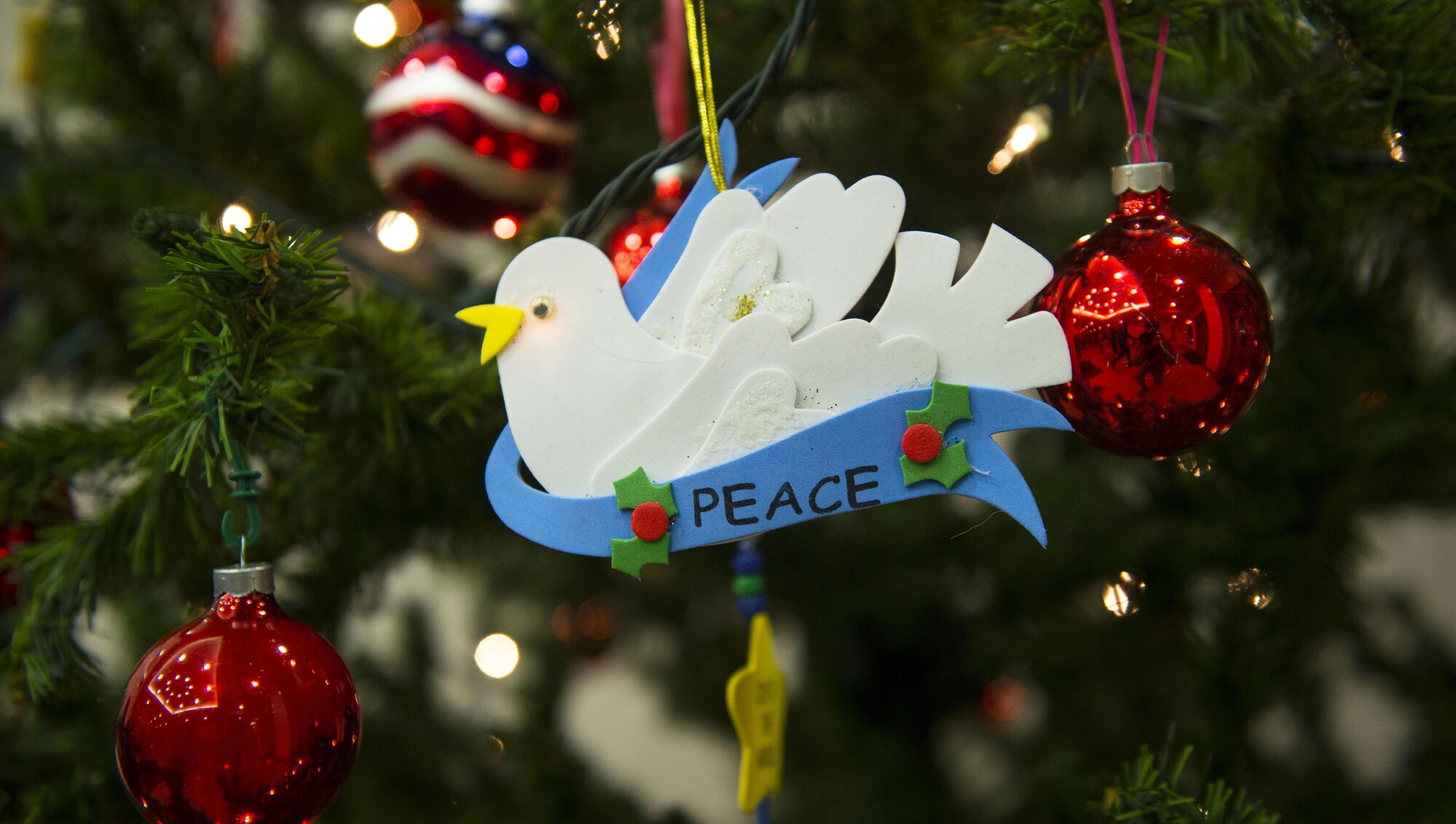 Christmas ornaments hang from a tree at the main chapel at Yokota Air Base, Japan, Dec. 1, 2016. The tree lighting marks the official start of the holiday season at Yokota. (U.S. Air Force Photo by Airman 1st Class Juan E. Torres/Released)