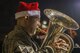 U.S. Air Force Master Sgt. Karl N. Bradley, Pacific Brass bandsmen, performs at a tree lighting ceremony at the main chapel at Yokota Air Base, Japan, Dec. 1, 2016. Bradley, along with the rest of the Pacific Brass members, performs holiday favorites for those who assisted the ceremony. (U.S. Air Force Photo by Airman 1st Class Juan E. Torres/Released)