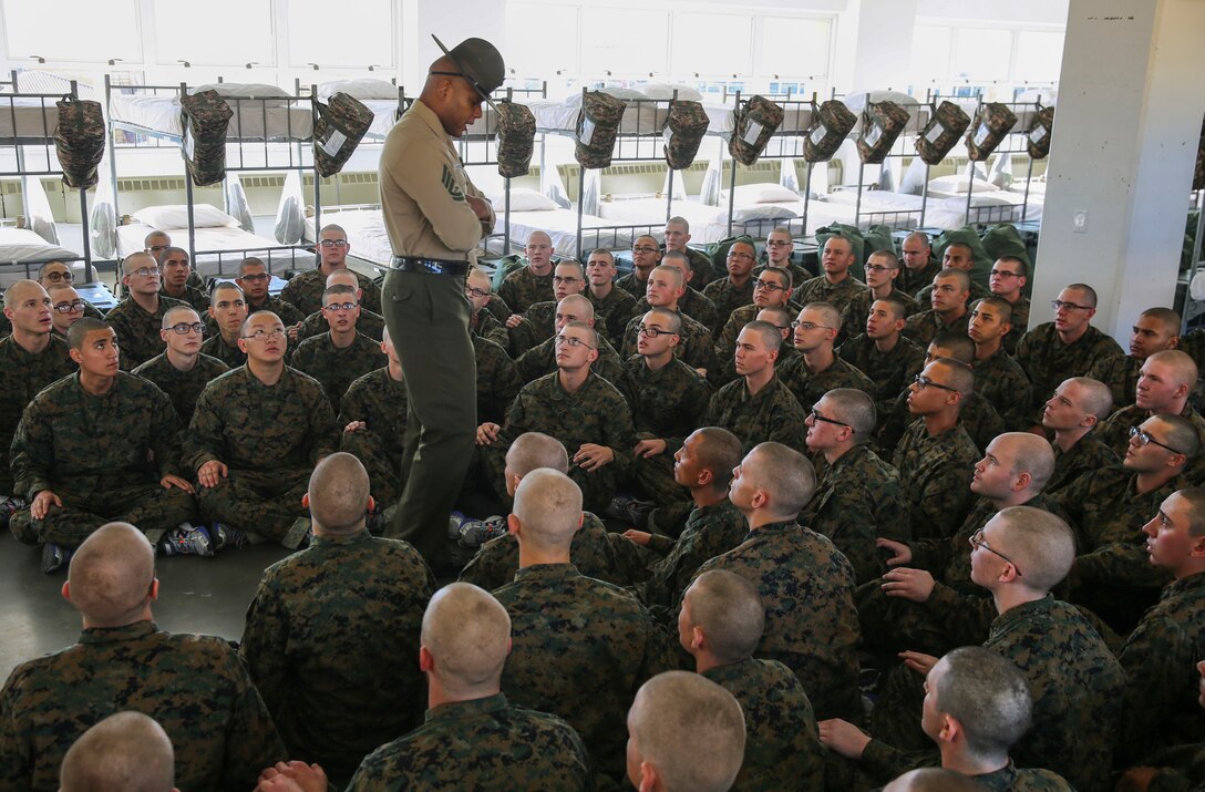 Recruits with India Company, 3rd Recruit Training Battalion, receive instructions from their senior drill instructor during pick up at Marine Corps Recruit Depot San Diego, Dec. 2. The recruits will spend their first day with their drill instructors learning the rules and regulations of recruit training, regarding everything from how to act in the squad bay to how to speak to drill instructors. Annually, more than 17,000 males recruited from the Western Recruiting Region are trained at MCRD San Diego. India Company is scheduled to graduate Feb. 24.
