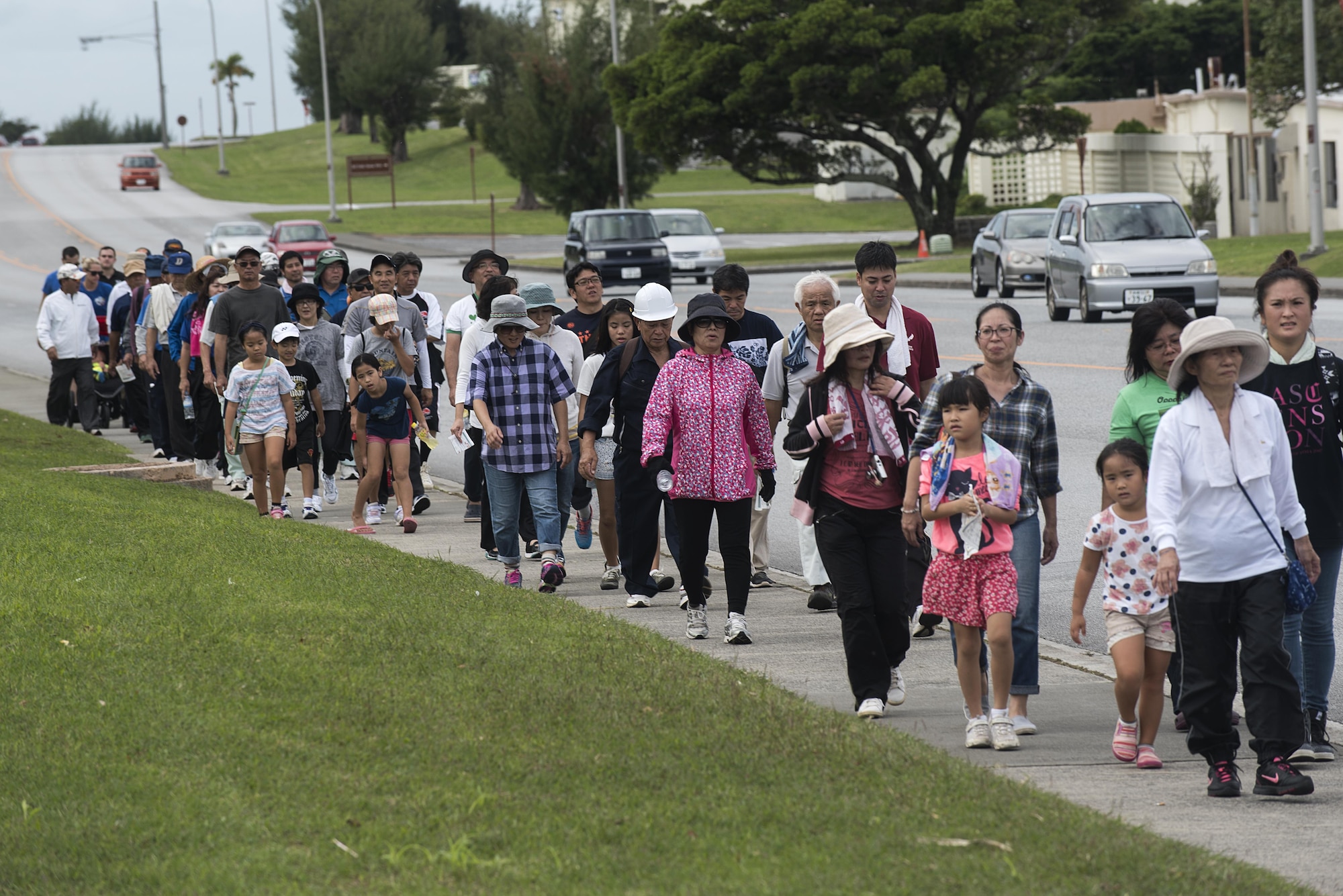 Residents of Chatan Town make their way through Kadena Air Base, Japan, as part of a bilateral tsunami evacuation exercise Dec. 4, 2016. U.S. Military and civil authorities must be prepared to face any emergency that could occur on Okinawa. The tsunami evacuation exercise is one possible scenario that both nations can train for, execute and evaluate. (U.S. Air Force photo by Airman 1st Class Corey Pettis/Released)