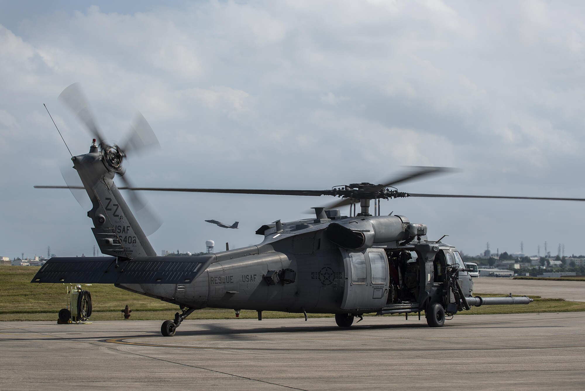 A U.S. Air Force HH-60G Pave Hawk from the 33rd Rescue Squadron prepares to take off Nov. 30, 2016, at Kadena Air Base, Japan. The primary mission of the HH-60G Pave Hawk helicopter is to conduct day or night personnel recovery operations into hostile environments to recover isolated personnel during war. (U.S. Air Force photo by Airman 1st Class Corey Pettis/Released)