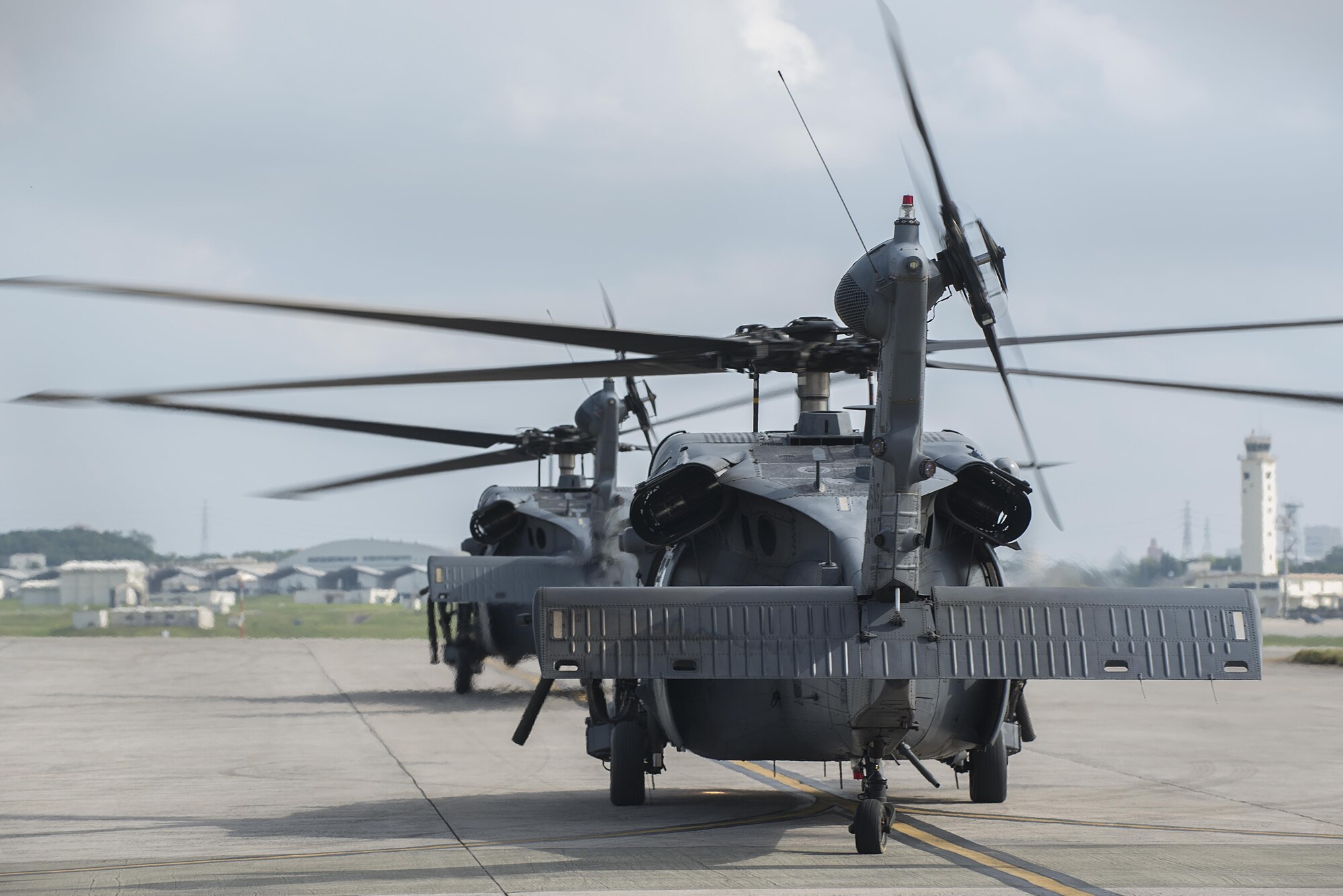 U.S. Air Force HH-60G Pave Hawks from the 33rd Rescue Squadron prepare to take off Nov. 30, 2016, at Kadena Air Base, Japan. The Pave Hawk is a twin-engine medium-lift helicopter operated by Air Combat Command, Pacific Air Forces, Air Education and Training Command, U.S. Air Forces in Europe, Air National Guard and Air Force Reserve Command. (U.S. Air Force photo by Airman 1st Class Corey Pettis/Released)