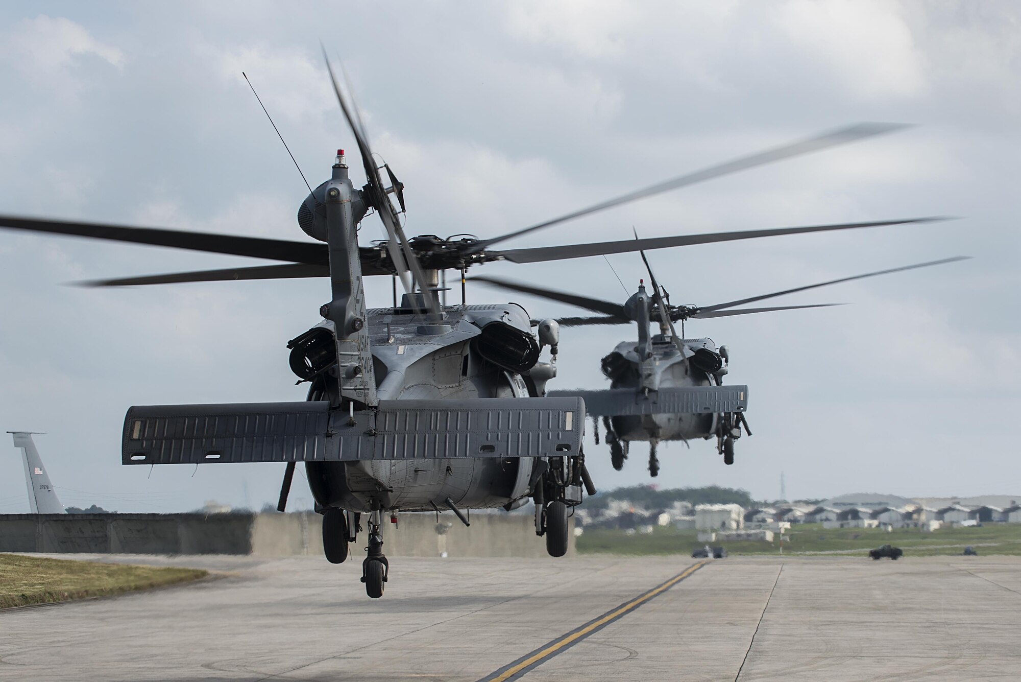 U.S. Air Force HH-60G Pave Hawks from the 33rd Rescue Squadron take off Nov. 30, 2016, at Kadena Air Base, Japan. Pave Hawks have a long history of use in contingencies, starting in Operation Just Cause. During Operation Desert Storm they provided combat search and rescue coverage for coalition forces in western Iraq, coastal Kuwait, the Persian Gulf and Saudi Arabia. (U.S. Air Force photo by Airman 1st Class Corey Pettis/Released)