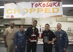 161205-N-ZL062-182
YOKOSUKA, Japan (Dec. 5, 2016) Sailors from various commands compete in the 3rd annual Chopped Yokosuka championship cooking competition held by Yokosuka MWR Japan and the Jewel of the East CFAY galley. This competition encourages Sailors to use their hidden talents in a creative way to express themselves, creating a positive experience. (U.S. Navy photo by Seaman Sarah Myers/Released)