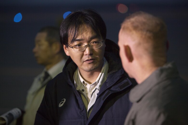 Kiyoshi Takahashi, Training Liaison Officer for Head Quarters United States forces Japan, left, speaks with U.S. Marine Corps Lt. Col. John D. Ferguson, commanding officer of Marine Attack Squadron (VMA) 542, after the arrival of the squadrons AV-8B Harriers for the Aviation Training Relocation Program at Chitose Air Base, Japan, Dec. 5, 2016. Following the arrival of the squadron’s Harriers, a press conference was held to acknowledge questions pertaining to the aircraft and the ATR. (U.S. Marine Corps photo by Cpl. James A. Guillory)