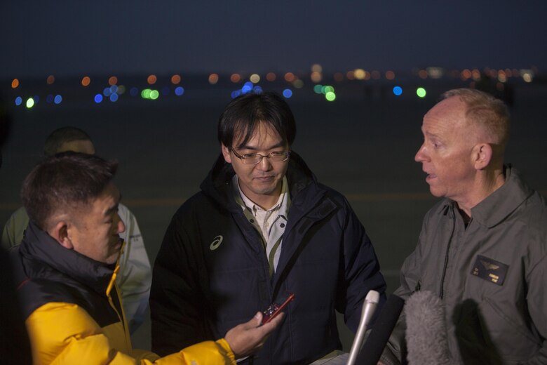 A Japanese local media reporter, left, questions U.S. Marine Corps Lt. Col. John D. Ferguson, commanding officer of Marine Attack Squadron (VMA) 542, right, after the arrival of the squadrons AV-8B Harriers for the Aviation Training Relocation Program at Chitose Air Base, Japan, Dec. 5, 2016. Following the arrival of the squadron’s Harriers, a press conference was held to acknowledge questions pertaining to the aircraft and the ATR. (U.S. Marine Corps photo by Cpl James A. Guillory)
