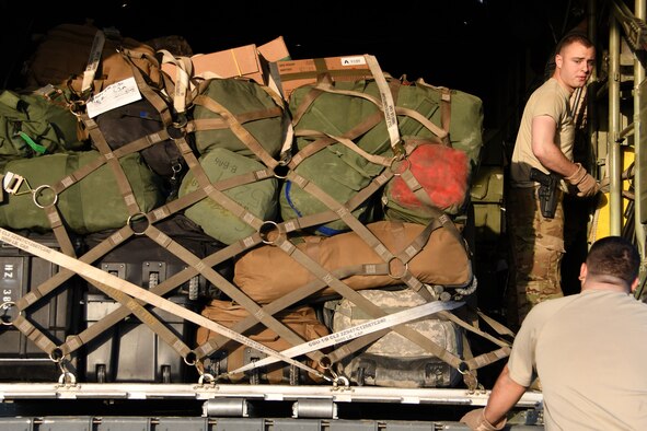 William Haas, a 737th Expeditionary Airlift Squadron loadmaster, top right, talks with Cody Margetis, a 737th EAS loadmaster, bottom right, while securing aircraft equipment in the cargo area of a C-130H Hercules at an undisclosed location in Southwest Asia Dec. 4, 2016. Over the last three months, C-130s assigned to the 386th moved an average of nearly 6,000 tons of cargo throughout the U.S. Central Command area of responsibility in support of Operation Inherent Resolve. (U.S. Air Force photo/Senior Airman Andrew Park)