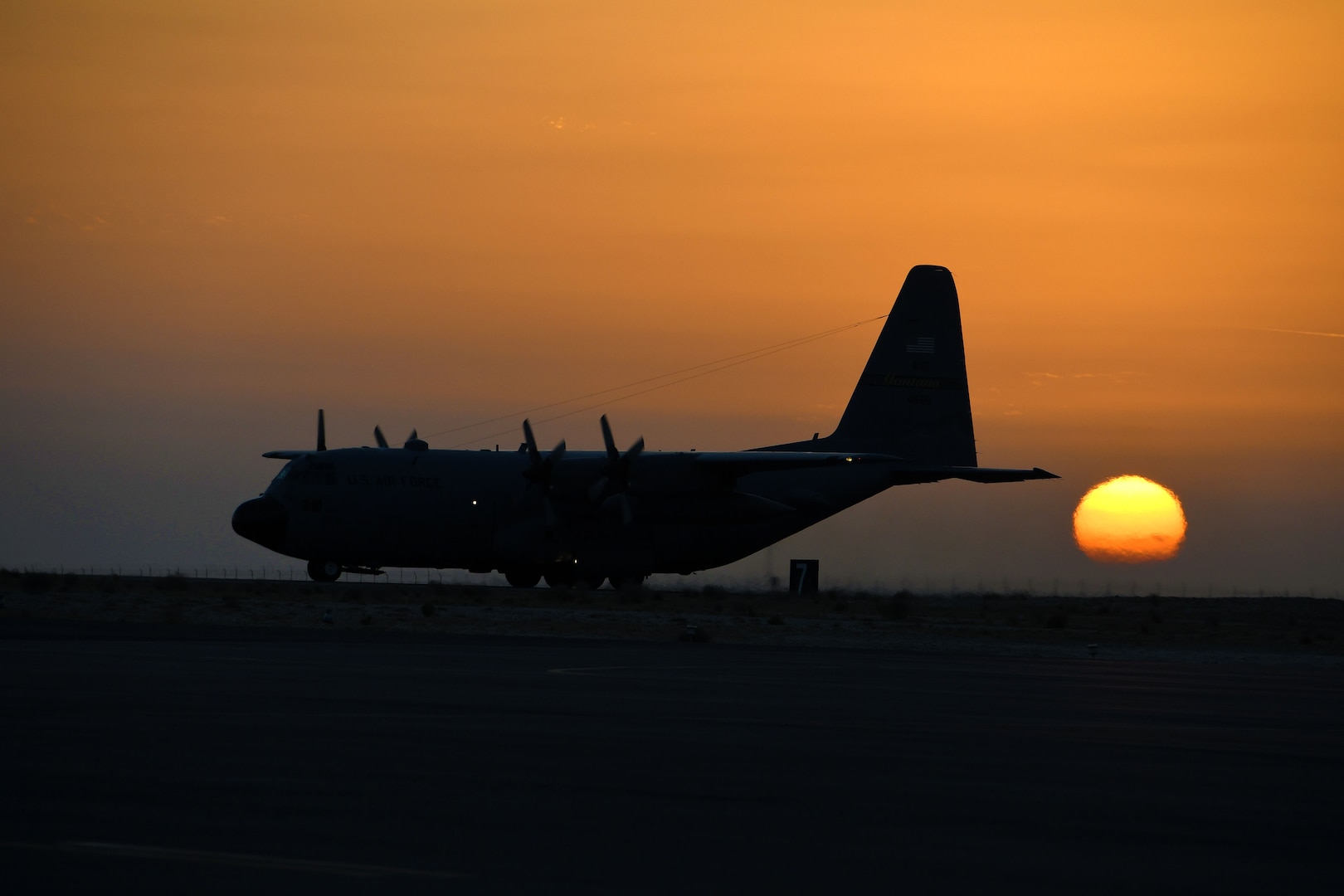 A C-130H Hercules taxis down the runway prior to takeoff at an undisclosed location in Southwest Asia Dec. 4, 2016. Some C-130s have already flown upwards of 800 hours in a single month. (U.S. Air Force photo/Senior Airman Andrew Park)