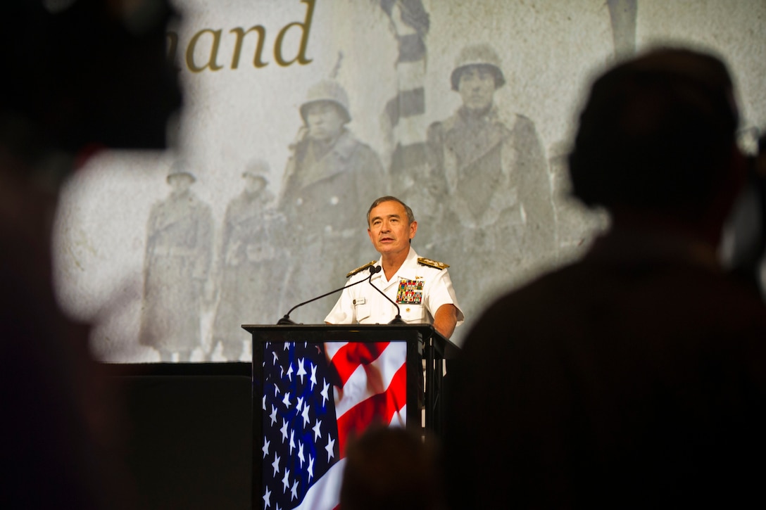 Navy Adm. Harry B Harris Jr., commander of U.S. Pacific Command, speaks at a tribute for Japanese-American veterans who served in World War II, in Honolulu, Dec. 5, 2015. The "Fighting Two Wars" event honored the bravery and loyalty of the Japanese Americans who served after Pearl Harbor, even in the face of discrimination and distrust. DoD photo by Lisa Ferdinando