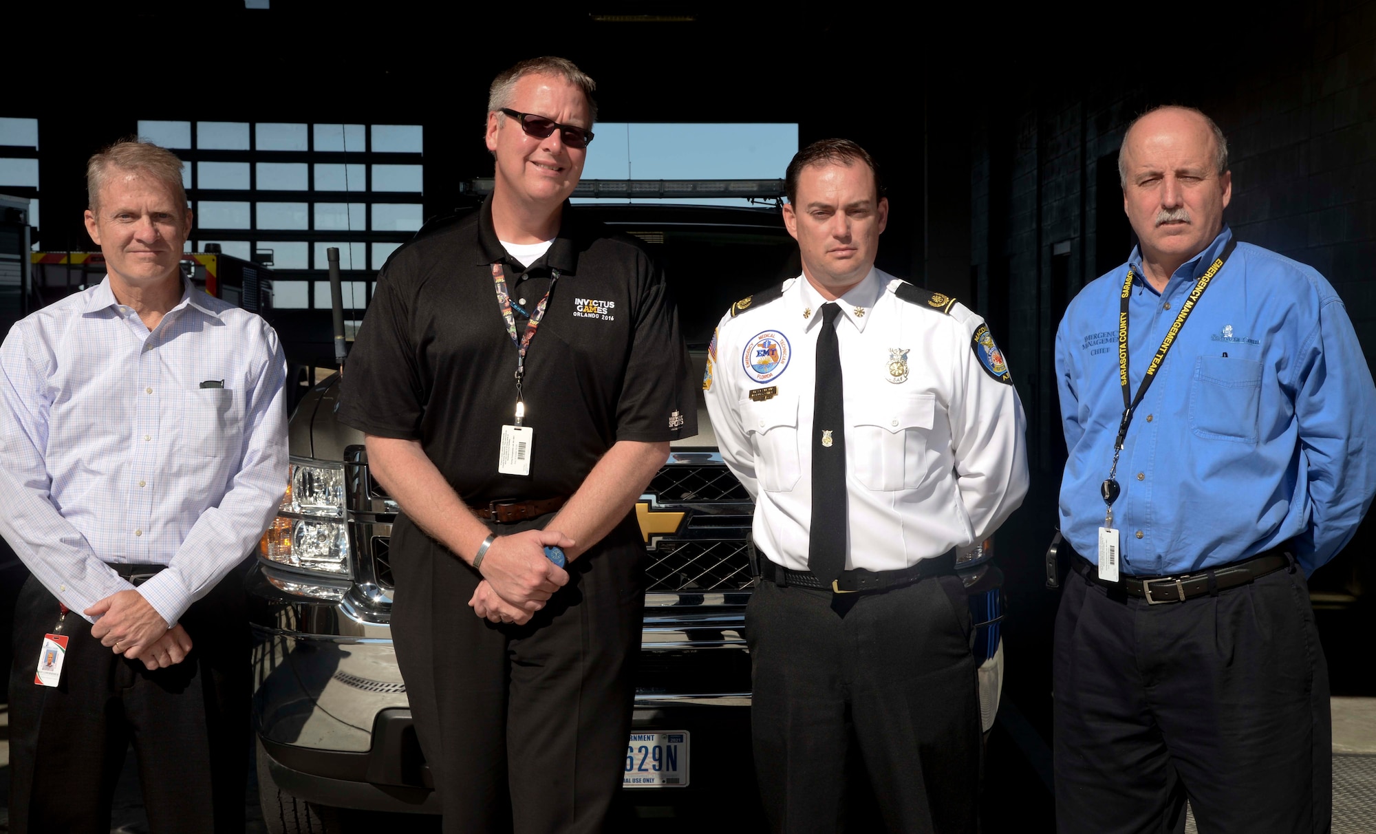 Members of the Sarasota Emergency Services (EMS) team pause for a photo with Matthew Amann, second from right, the deputy fire chief assigned to the 6th Civil Engineer Squadron, during a tour at MacDill Air Force Base, Fla., Dec. 2, 2016. The EMS team visited MacDill to view its command post and emergency services operations, as well as compare processes with Team MacDill’s.(U.S. Air Force photo by Senior Airman Vernon L. Fowler Jr.)