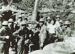 Gun crew from 200th Coast Artillery Regiment, New Mexico National Guard, with 3-inch M2 anti-aircraft gun in the Philippine Islands, in late 1941 or early 1942.