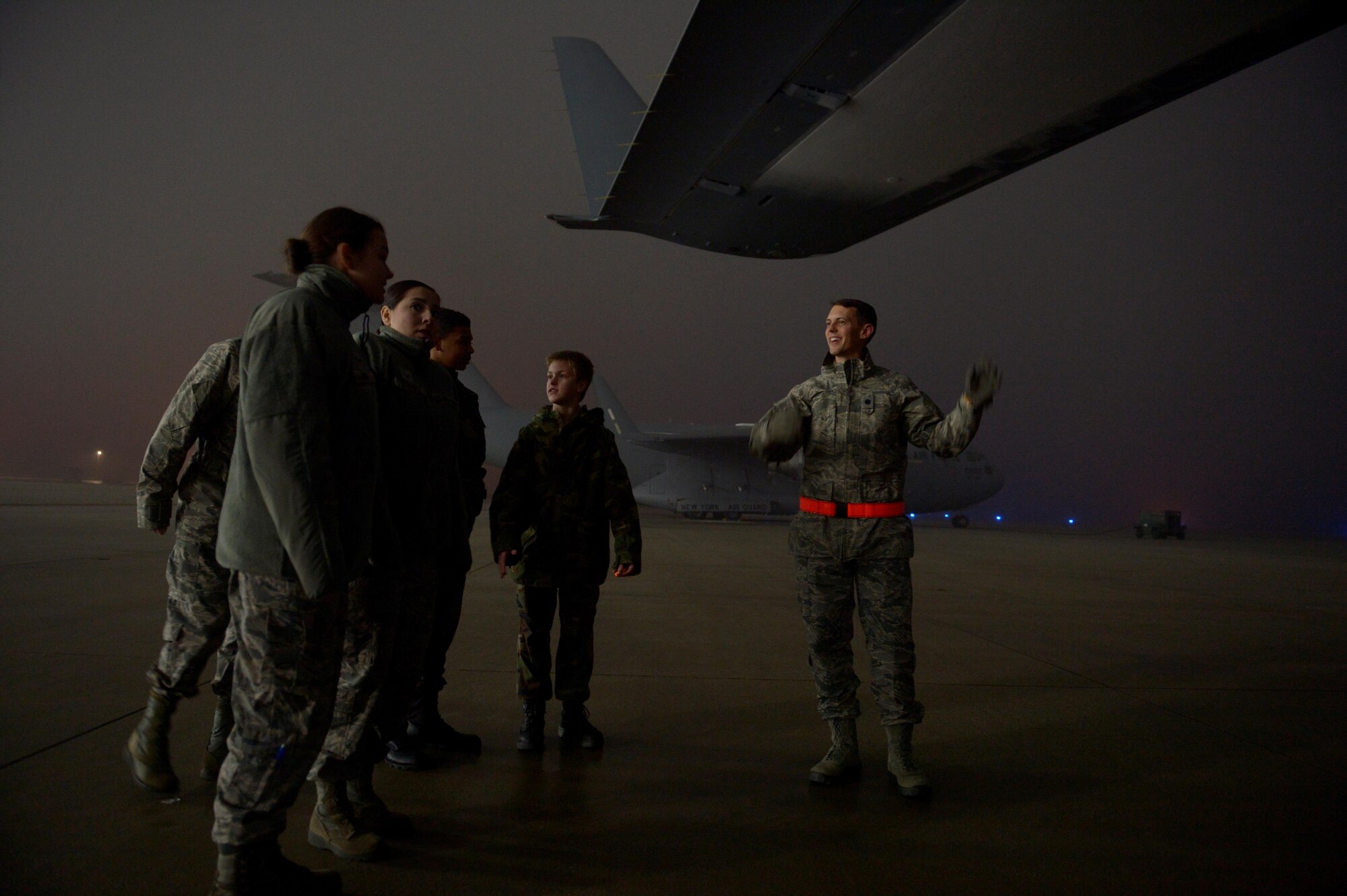 Lt. Col. Christopher Ott, right, 726th Air Mobility Squadron, talks about a C-17 Globemaster III to Civil Air Patrol cadets from Squadron 126 at Spangdahlem Air Base, Germany, Dec. 1, 2016. The CAP youth program trains them to be leaders and offers aerospace education. (U.S. Air Force photo by Staff Sgt. Jonathan Snyder)