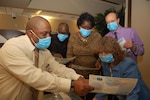 Andre Gross, Defense Contract Management Agency’s Emergency Preparedness and Continuity of Operations program manager, provides a brochure on influenza prevention tips to DCMA employees Kermit Rice, Yvette McDuffie, Tom Krenik and Diane Beall during the simulated pandemic influenza exercise, Nov. 15-17, at Fort Lee, Virginia. (DCMA photo by Tonya Johnson) 


