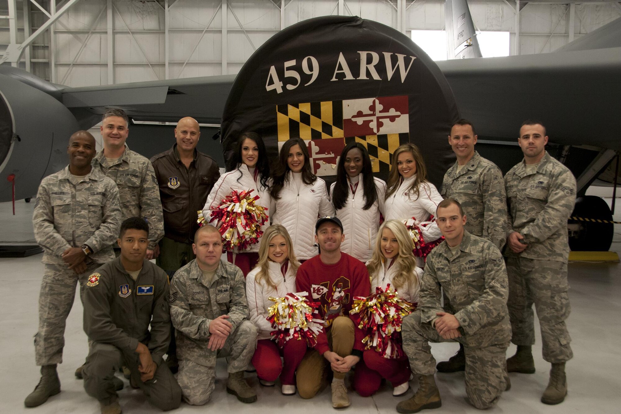 The Kansas City Chiefs' Cheerleaders pose for a photo with members of the 459th Air Refueling Wing in front of a KC-135R Stratotanker during a visit to the 459th ARW on Joint Base Andrews, Maryland, Dec. 3, 2016. The visit was part of a Morale, Wellness and Recreation event where the cheerleaders toured the base and met with Airmen. (U.S. Air Force photo/ 2nd Lt. Katie Spencer)

