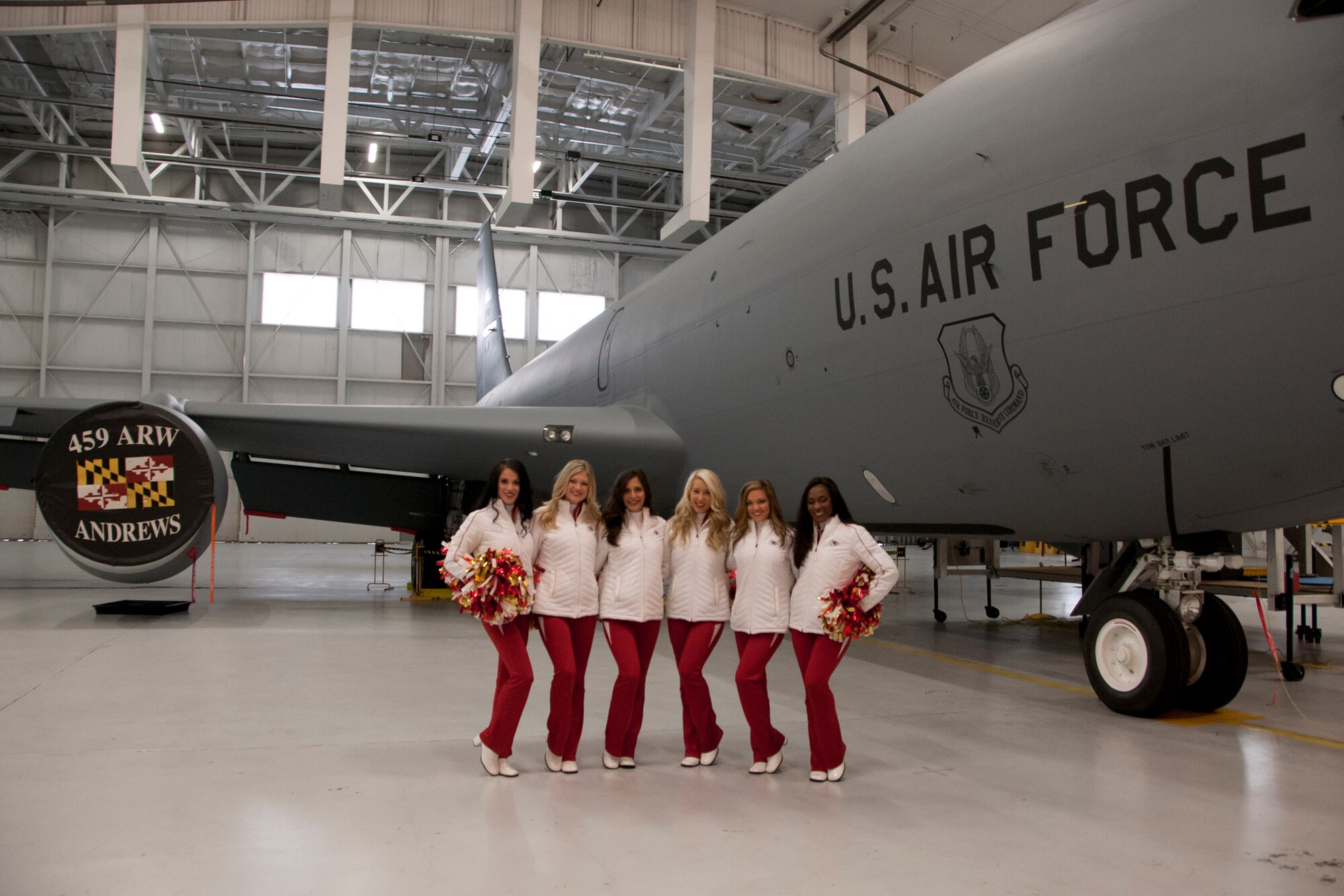 The Kansas City Chiefs' Cheerleaders pose for a photo in front of a KC-135R Stratotanker during a visit to the 459th Air Refueling Wing on Joint Base Andrews, Maryland, Dec. 3, 2016. The visit was part of a Morale, Wellness and Recreation event where the cheerleaders toured the base and met with Airmen. (U.S. Air Force photo/ 2nd Lt. Katie Spencer)

