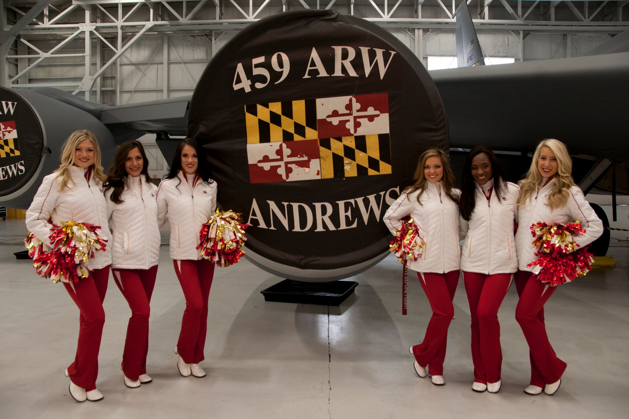 The Kansas City Chiefs' Cheerleaders pose for a photo in front of a KC-135R Stratotanker during a visit to the 459th Air Refueling Wing on Joint Base Andrews, Maryland, Dec. 3, 2016. The visit was part of a Morale, Wellness and Recreation event where the cheerleaders toured the base and met with Airmen. (U.S. Air Force photo/ 2nd Lt. Katie Spencer)

