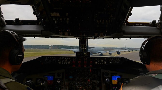 U.S. Air Force Lt. Col. Roland Tsui, left, 314th Air Refueling Squadron commander, and U.S. Air Force Capt. Jordan Paragoso, 314th ARS KC-135 Stratotanker pilot, from Beale Air Force Base, Calif., prepare for takeoff Dec. 2, 2016, on RAF Mildenhall, England. Members of the 314th ARS flew in a three-ship formation with KC-135s from the 351st Air Refueling Squadron. (U.S. Air Force photo by Staff Sgt. Micaiah Anthony) 
